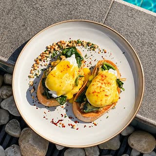Eggs Florentine at Amber Poolside, poached eggs over spinach on toasted muffins.
