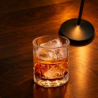 The Rooftop Reserve, whisky over ice in a cut-glass tumbler on the bar at Cloud Café & Bar.