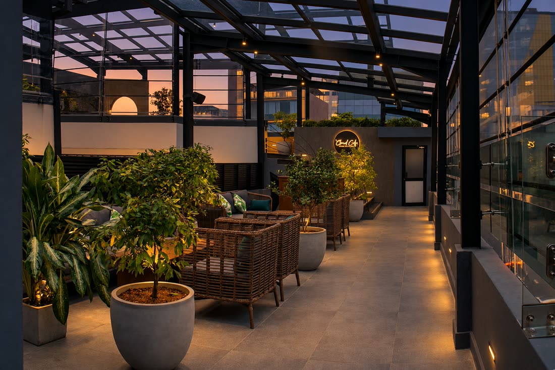Low seating on the roof at Cloud Caf&eacute; & Bar at dusk, warm light over the planting.